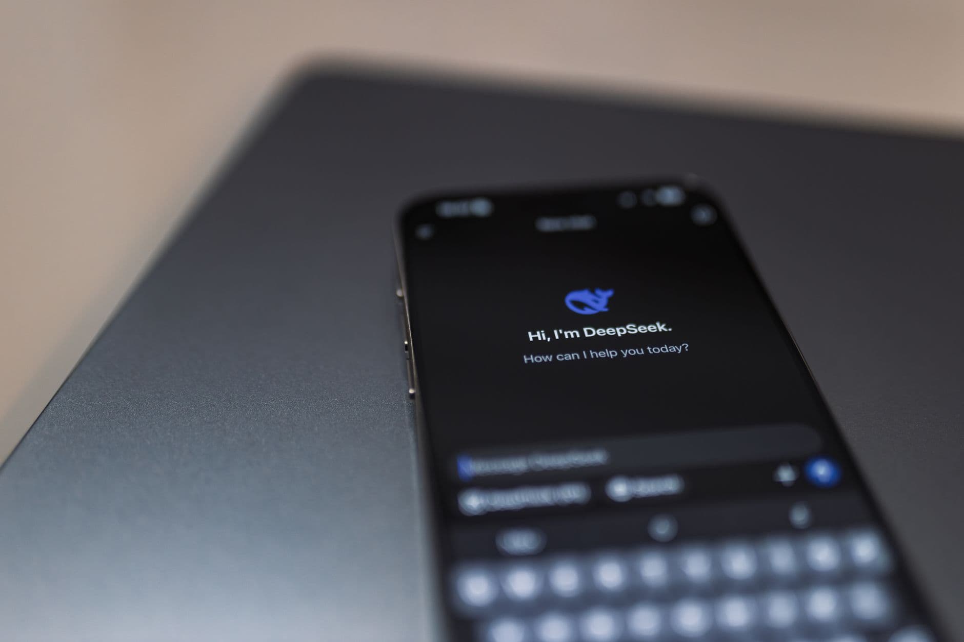 Person using WhatsApp on a smartphone with automated chat bubbles
